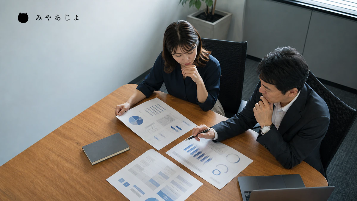 経営者と担当者がSEO施策の成果指標と作業範囲を確認するイメージ