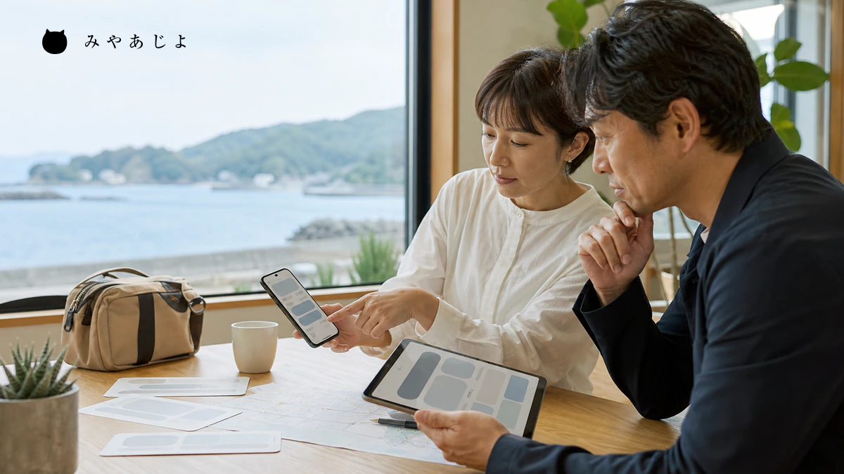 観光事業者がスマートフォンの予約画面と多言語情報を点検するイメージ